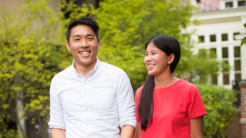 An outdoor photo of a faculty member and his partner.