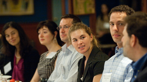 Group of faculty members having a discussion.