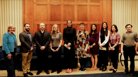 A group of faculty members on stage.
