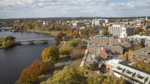 Aerial view of Harvard buildings alongside the Charles River.