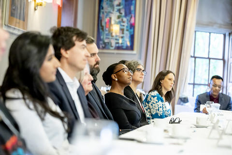 Attendees listening to participant introductions.