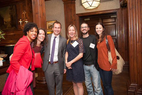 Six new faculty members stand together and pose for a group shot.