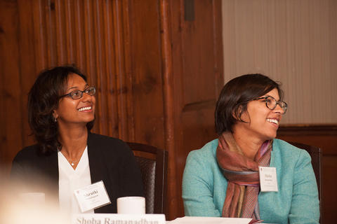 Two attendees listen to the NFI speeches.